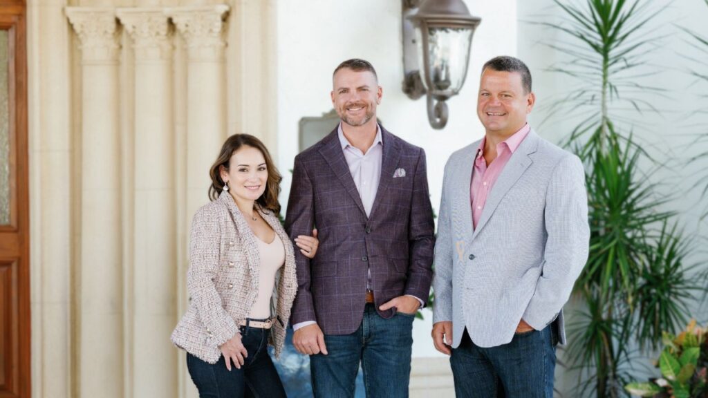 Worthington Realty’s new leadership team—Michael Davis, Susana Davis, and Brian Rodgers—standing together in Fort Myers, Florida