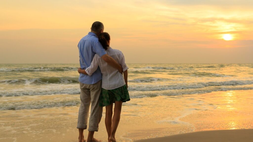 Couple watching a sunset after moving to Fort Myers Florida