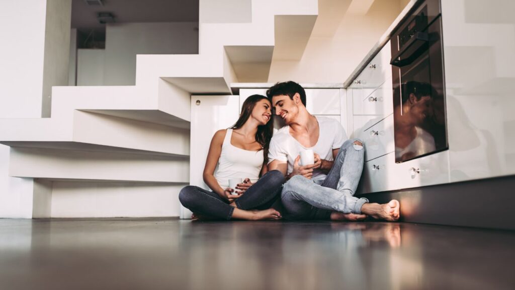 Happy couple in their new kitchen built by custom home builders in Southwest Florida