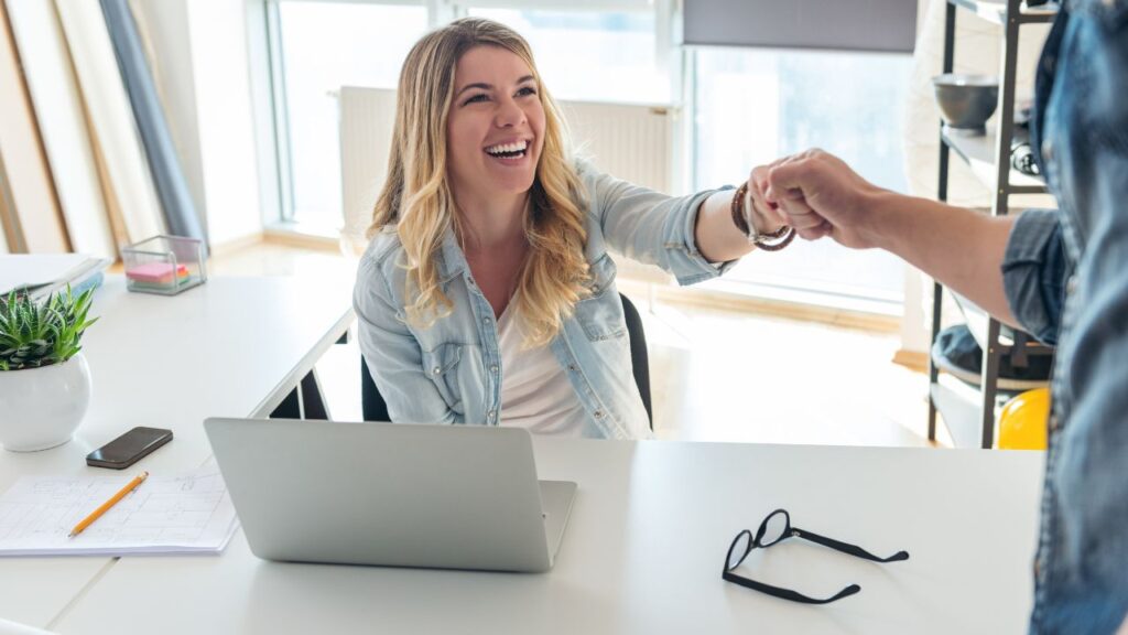 Real estate agent receiving support at a Fort Myers real estate brokerage