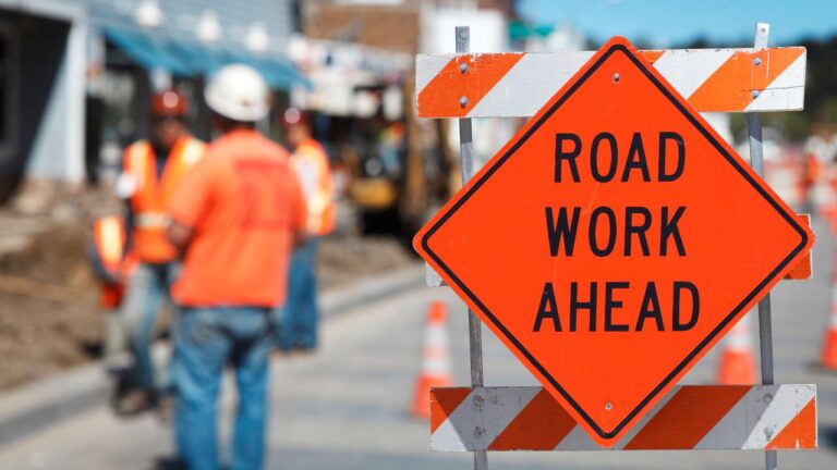 Road work ahead sign during construction on Daniels Parkway in Fort Myers