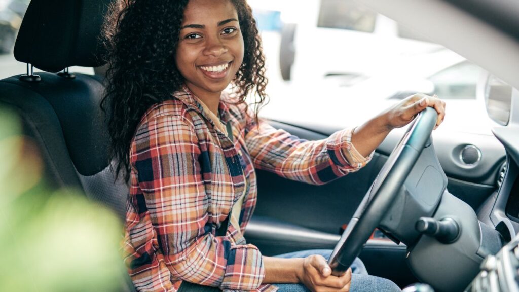 Smiling driver on Daniels Parkway in Fort Myers near ongoing road projects