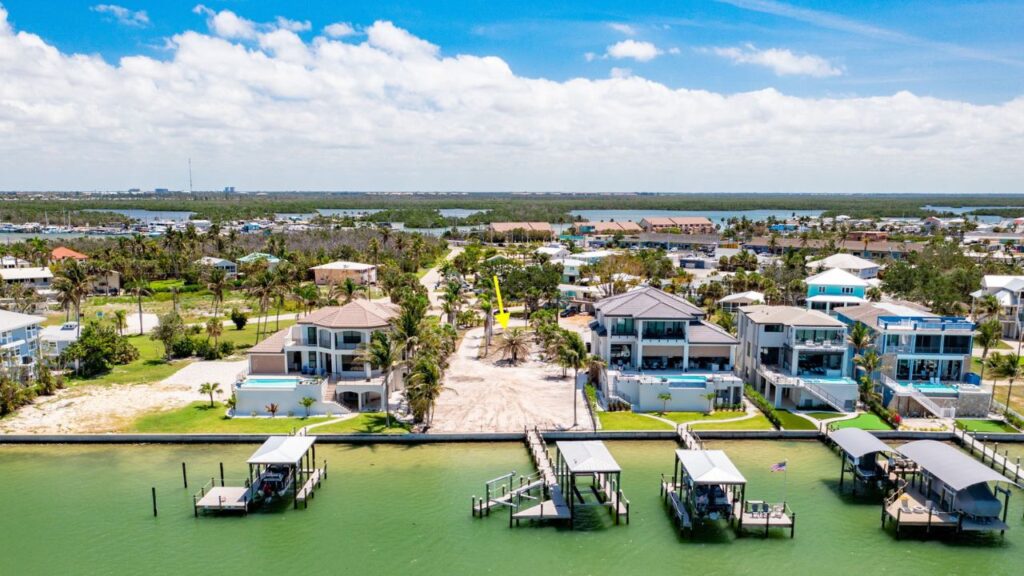 Aerial view of a Fort Myers Beach waterfront lot with boat docks and gulf access