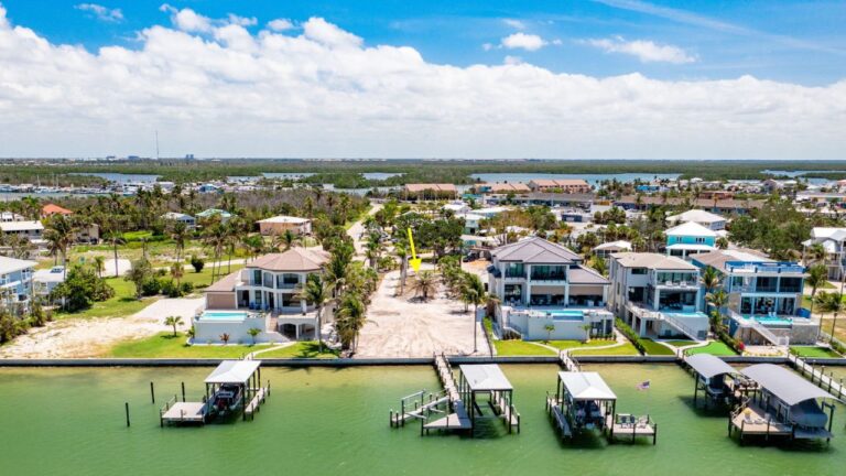 Aerial view of a Fort Myers Beach waterfront lot with boat docks and gulf access
