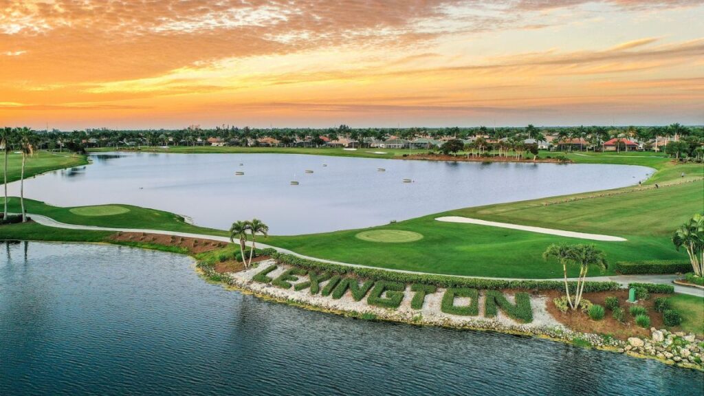Aerial view of the Lexington Country Club golf course at sunset, near the Waterford golf condos in Fort Myers