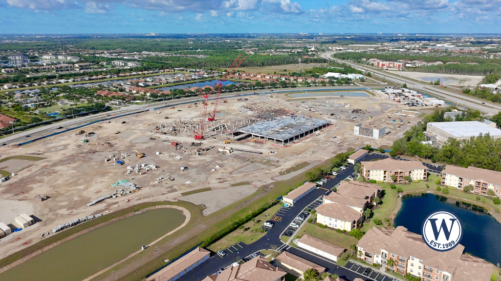 Aerial view of new hospital construction in Fort Myers, showing proximity to residential neighborhoods and major roads