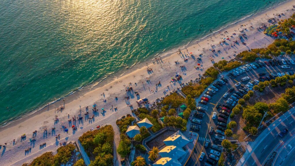 Waterfront homes and boats along the shoreline in Bonita Springs during daylight, representing the Bonita Springs Real Estate market update
