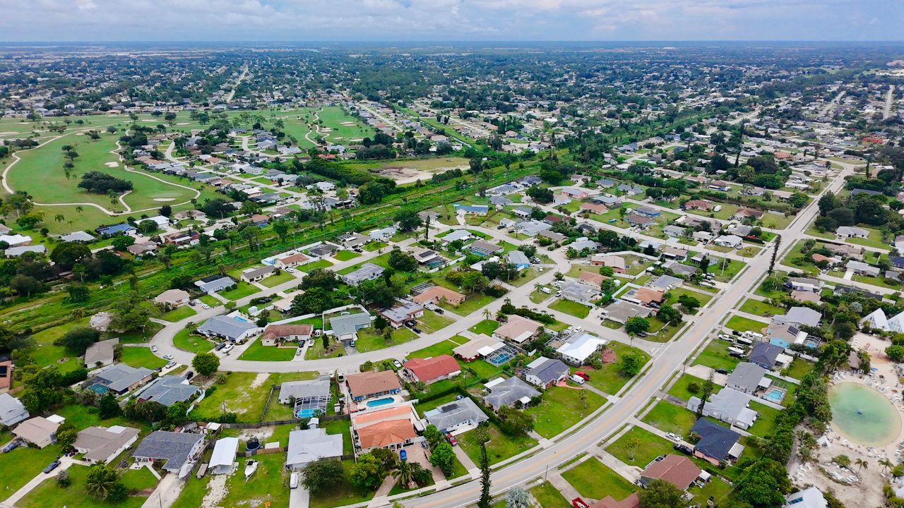 Aerial view of homes and streets in the San Carlos Park neighborhood of Lee County, Florida