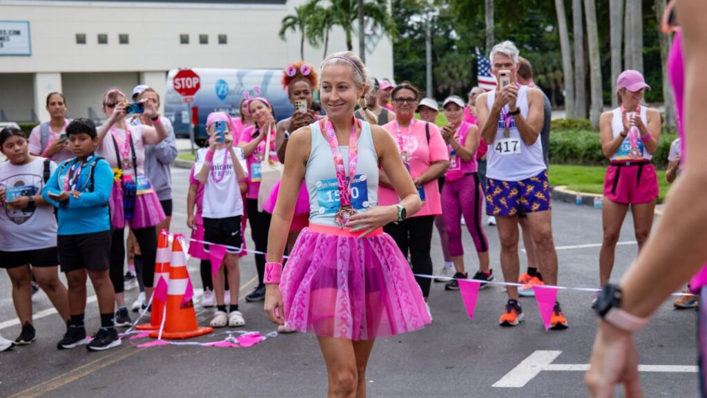 Erin Ward, MD of Coastal Women’s Wellness wins the Women’s 40–49 division at the Partners Pink Run Fort Myers 2025 at Bell Tower Shops.