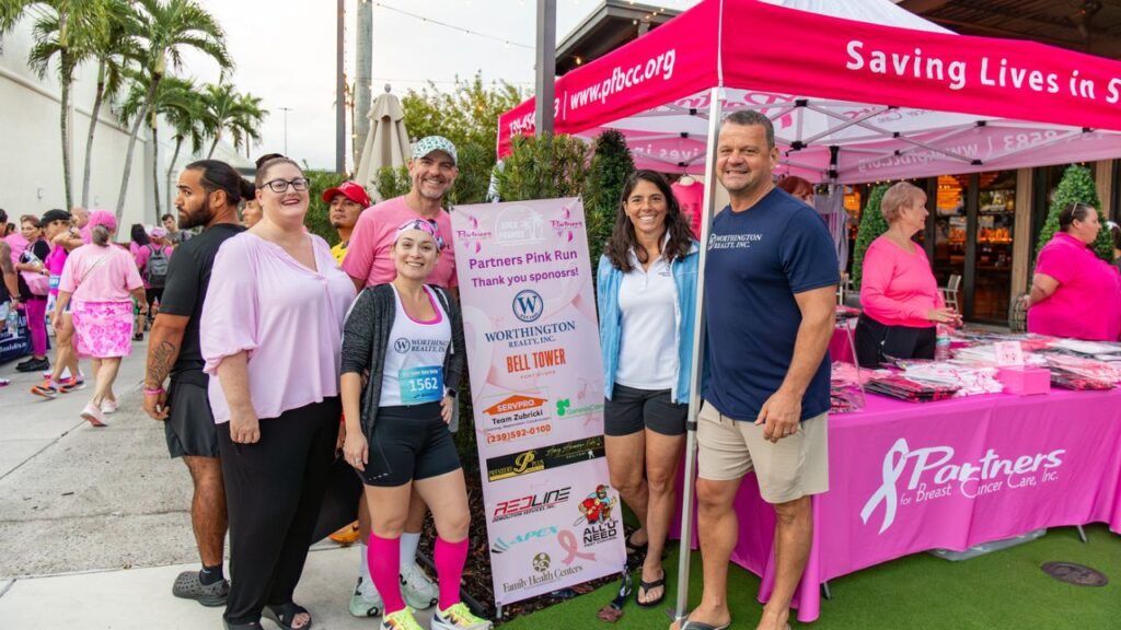 Worthington Realty team members Christine Shipman, Susana Alvarez Davis, Michael Davis, Stacey Rogers, and Brian Rodgers at the Partners Pink Run Fort Myers 2025.