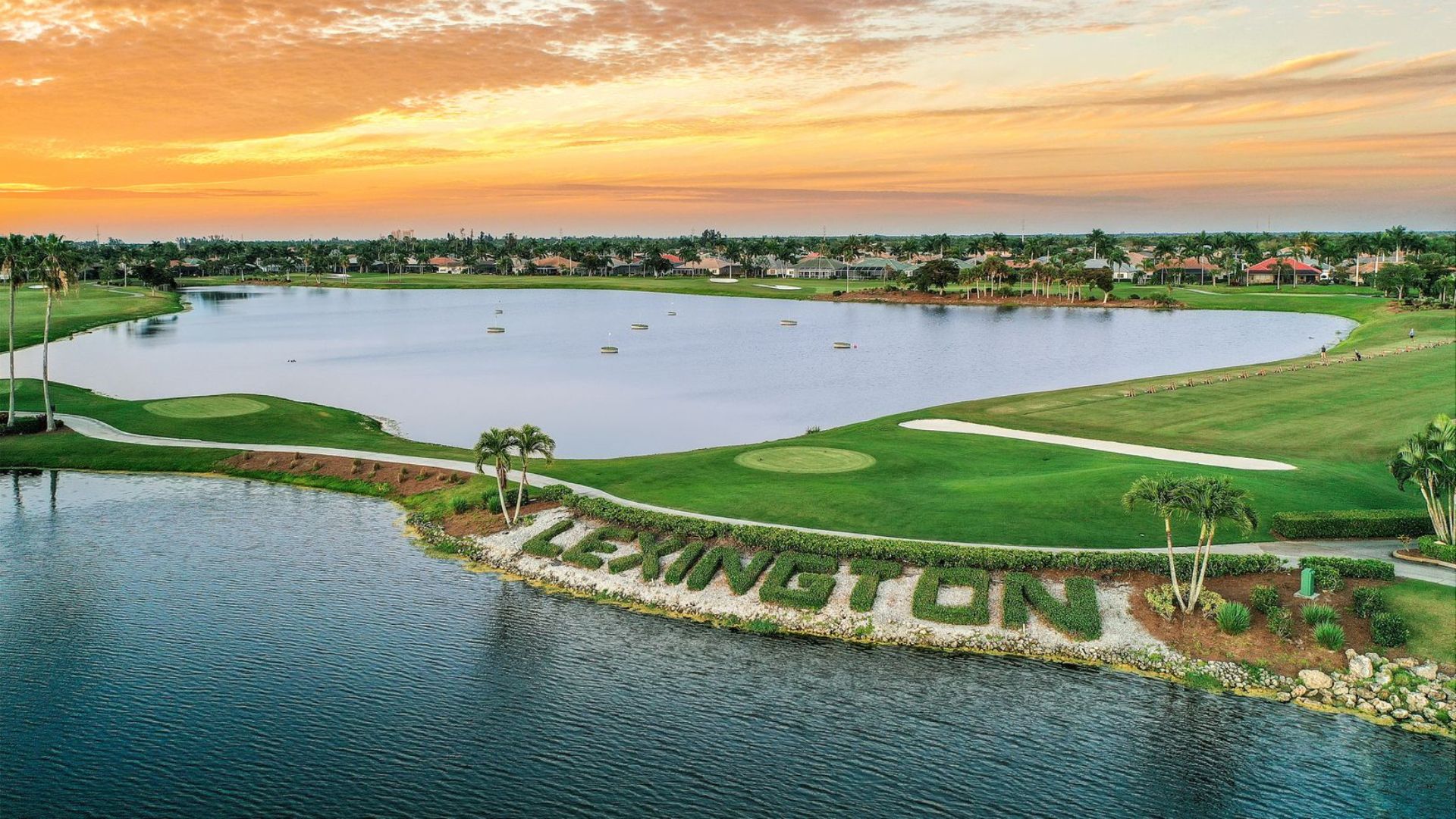 Lexington Country Club Market Update photo showing the lake, golf course, and surrounding homes at sunset in Fort Myers.