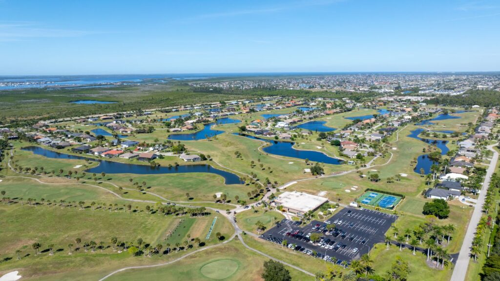 Aerial view of Cape Royal golf community in Cape Coral with fairways, lakes, and surrounding homes.