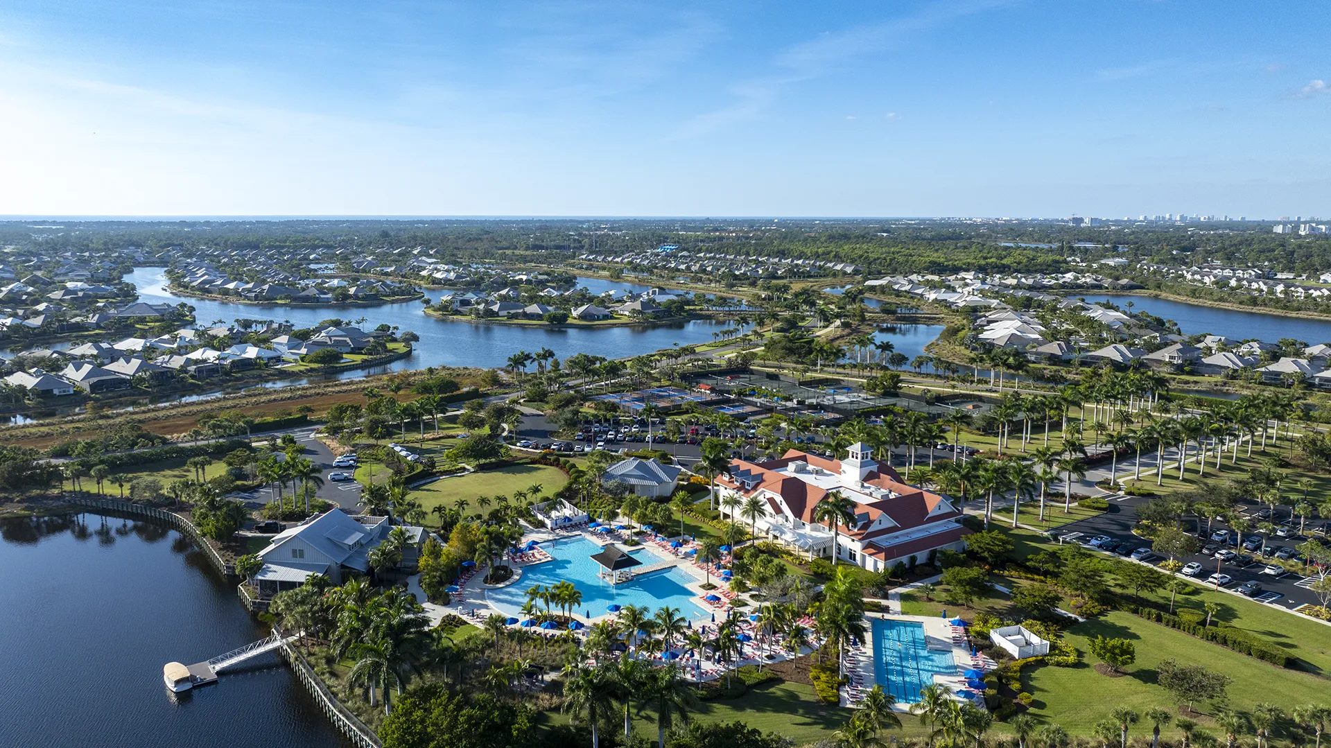 Aerial view of Isles of Collier Preserve in Naples, FL – gated community with homes for sale featuring lakes, preserves, and resort-style amenities