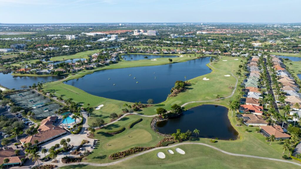 Aerial view of Lexington Country Club in Fort Myers showing golf courses, lakes, tennis courts, and surrounding homes.