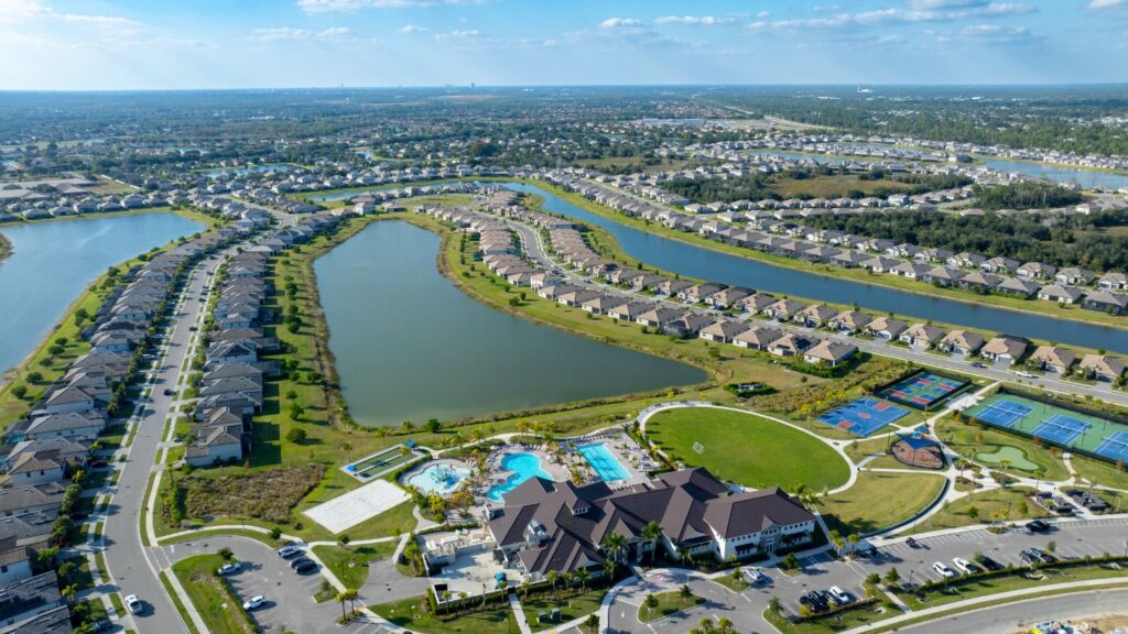 Aerial view of Timber Creek in Fort Myers with its clubhouse, pools, lakes, and surrounding homes.