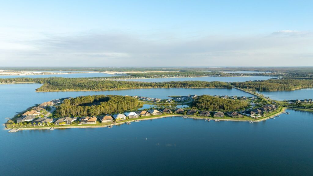 Aerial view of WildBlue in Fort Myers featuring expansive lakes, peninsula homes, and natural preserves.