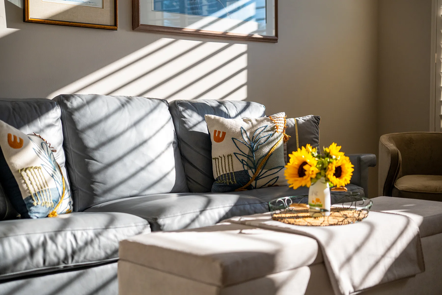 Sunlit Southwest Florida living room with sunflowers on the coffee table