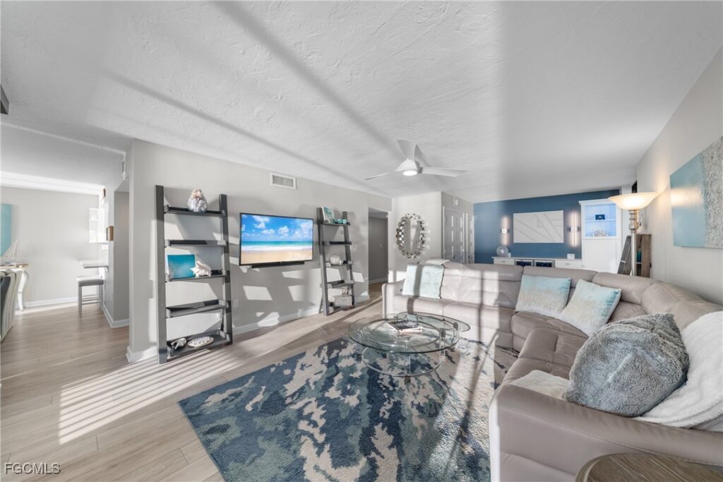 Open concept living room in renovated Gulf-front condo at Bayshores of Vanderbilt Beach Naples Florida