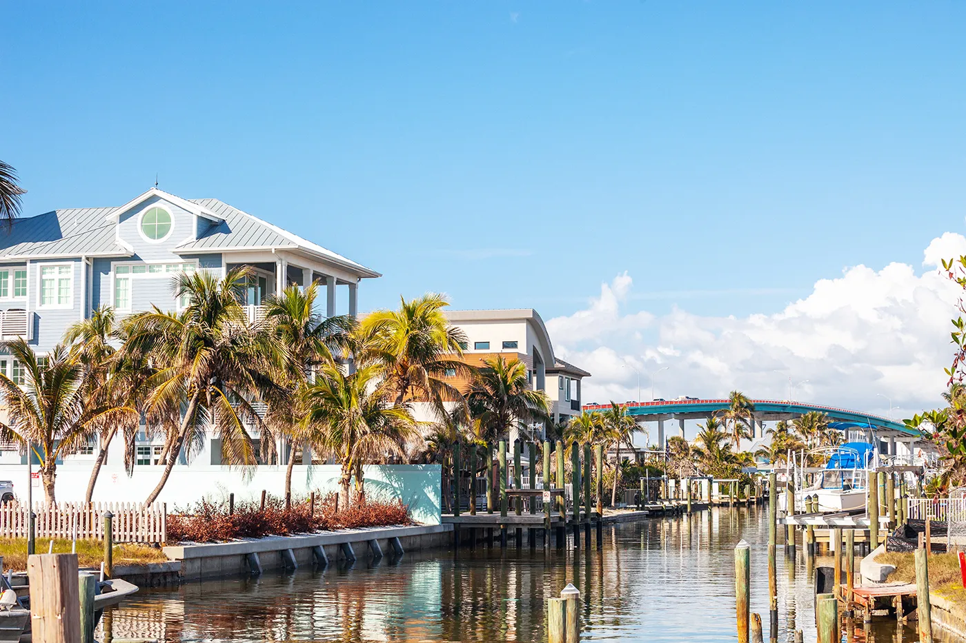 Waterfront homes along a canal in Fort Myers with docks and palm trees