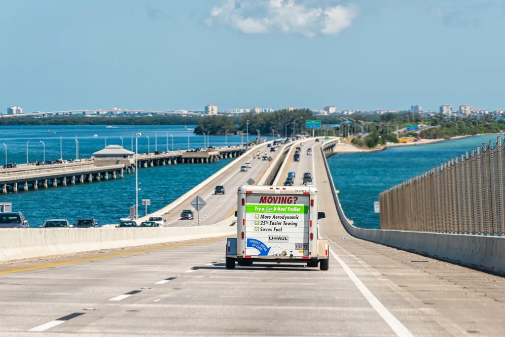 Moving truck on a Florida highway — who is moving to Southwest Florida from Illinois, New York, Massachusetts, and the Midwest