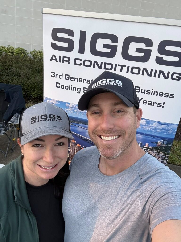 Kenny and Kirsten Siggs of Siggs Air Conditioning at a community running event in Fort Myers, Florida