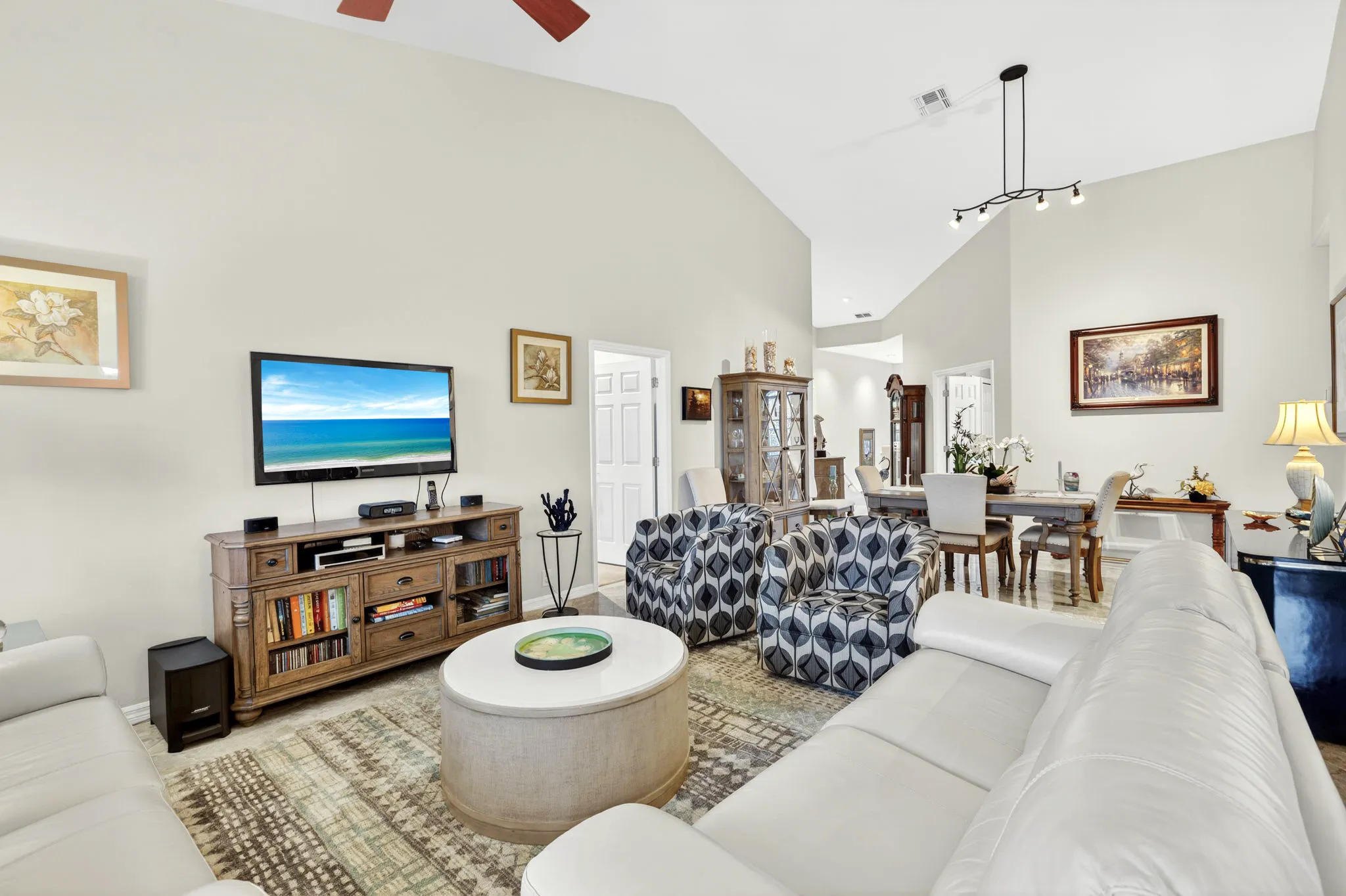 Vaulted great room opening to the dining area in a Lexington Country Club home, Fort Myers, Florida